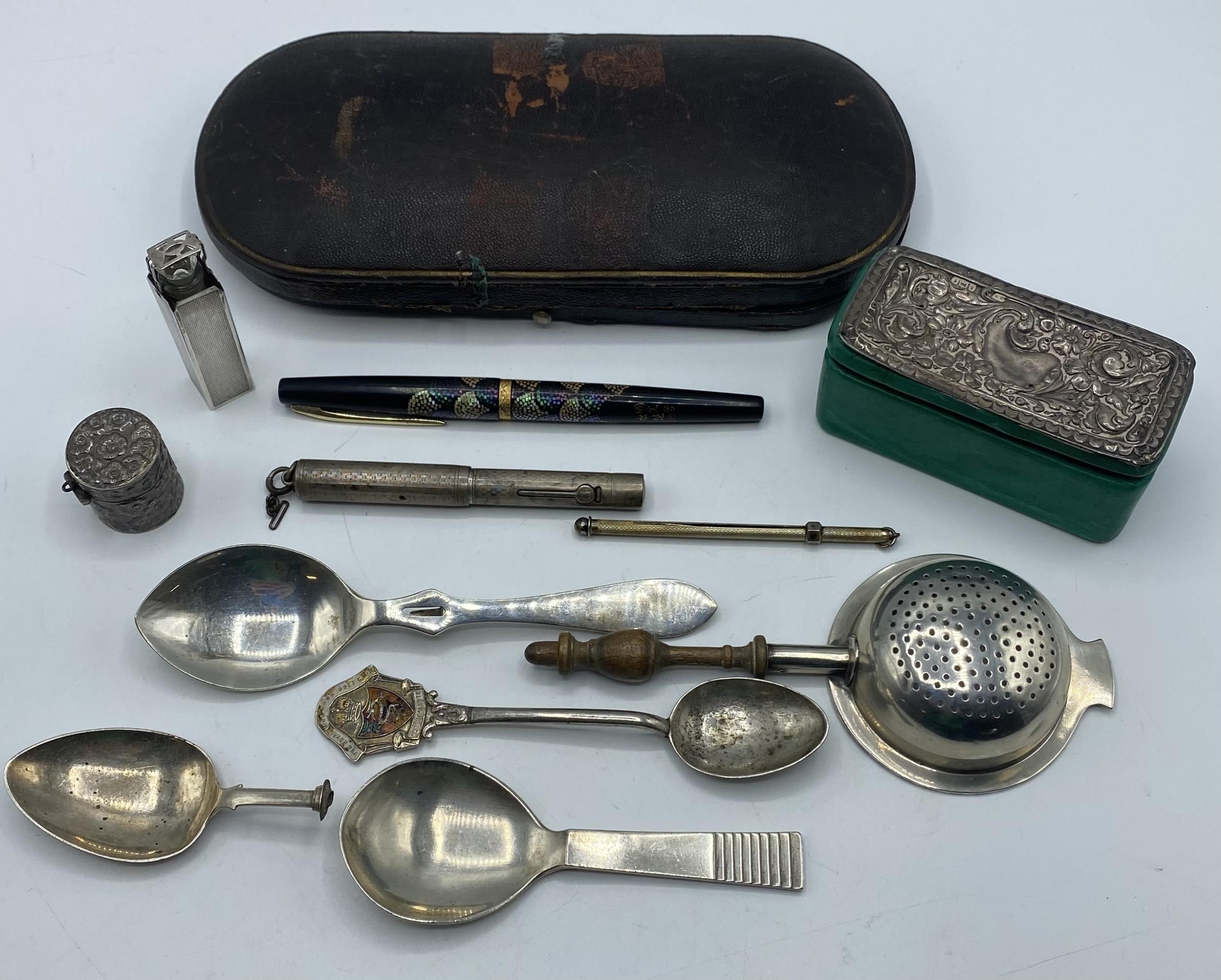 A collection of sterling silver items to include a Danish caddy spoon, a Mappin and Webb silver