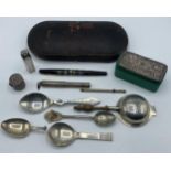 A collection of sterling silver items to include a Danish caddy spoon, a Mappin and Webb silver