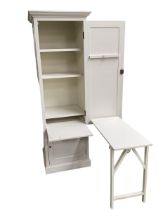 A white Oka tall narrow, two single door cupboard with key, opening to reveal shelves, and