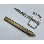 A 9ct gold engine turned etui containing collapsible stainless steel scissors. Case weight. 14.70g.