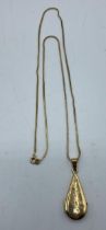 An 18ct gold tear drop locket on an 18ct gold snake link necklace. 62cm. 14.80g