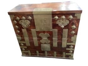 A Chinese style brass mounted dowry chest with fall front, 91cmW x 86cmH, with wear