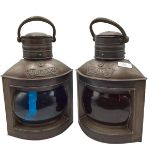 A pair of metal and glass ship lanterns marked Port and Starboard, with some wear and minor dents;