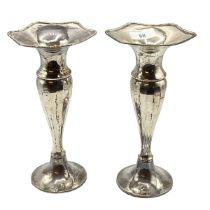 A pair of sterling silver trumpet vases with weighted bases. 23cm(h). 540 g