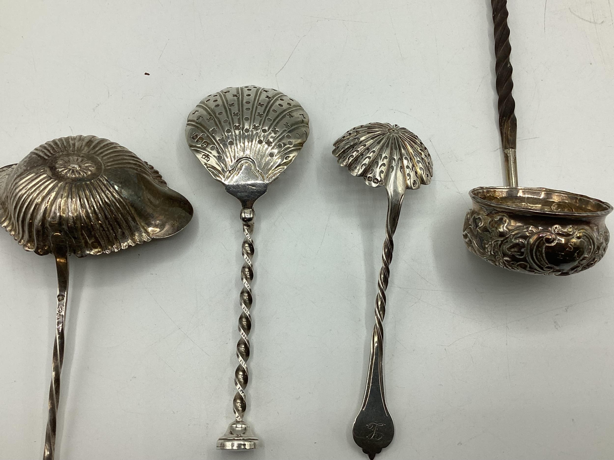 An unmarked white metal coin set toddy ladle with twisted horn/bone handle together with another - Image 3 of 5