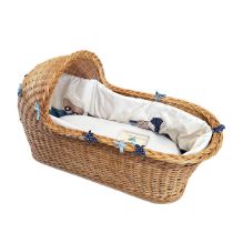 A moses basket, as new, with linen