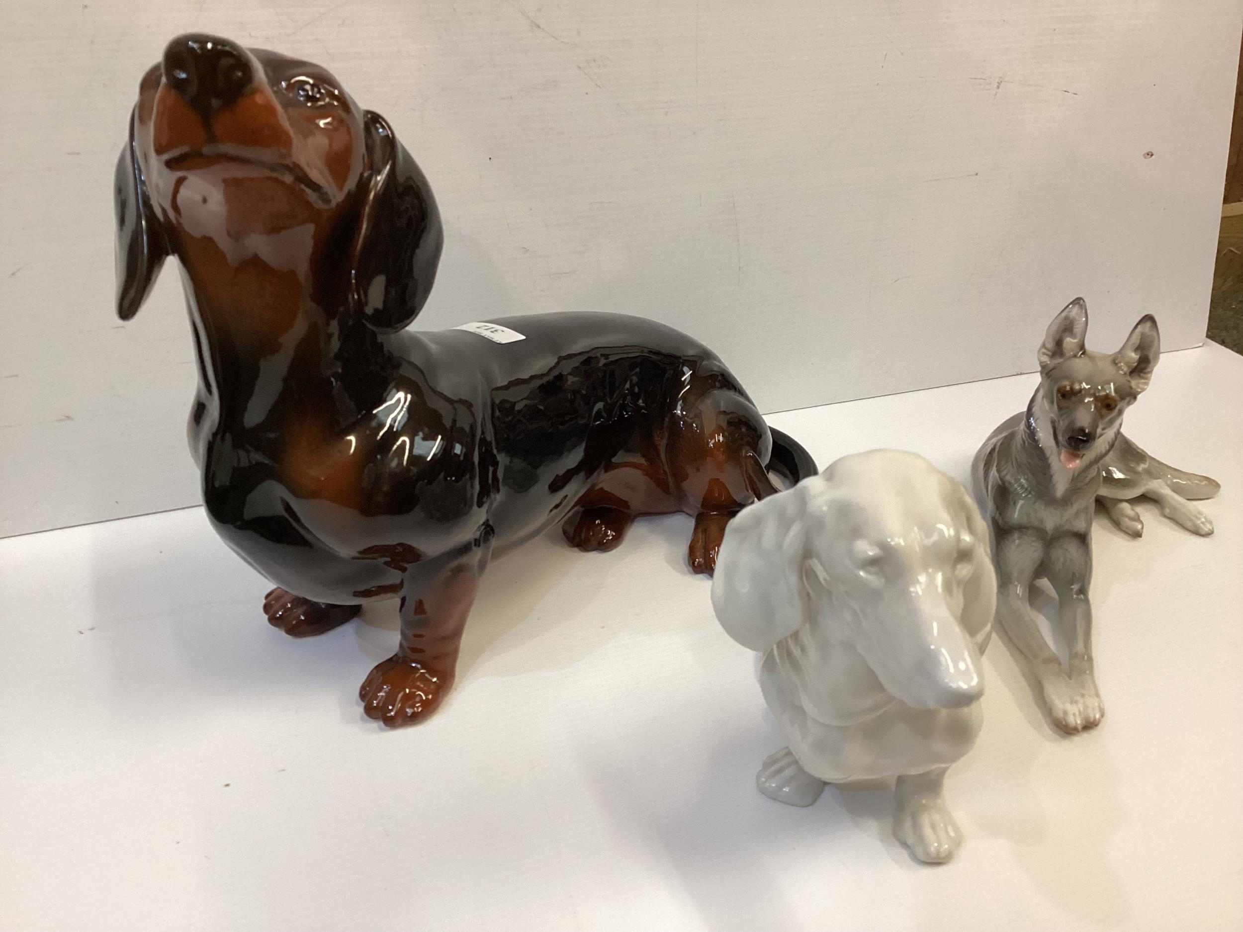 Three china dogs to include a Beswick Dachsund, A German Shepherd, Nymphenburg seated dog - Image 2 of 7