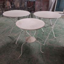 Two Ikea small circular folding bistro tables and another similar