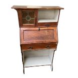 An Edwardian mahogany square two tier occasional table, with four extending turned columns to base