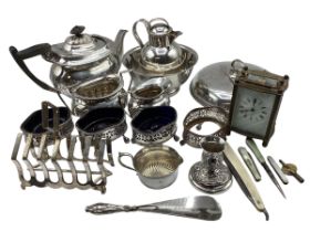 A collection of silver plated wares together with a brass carriage clock.