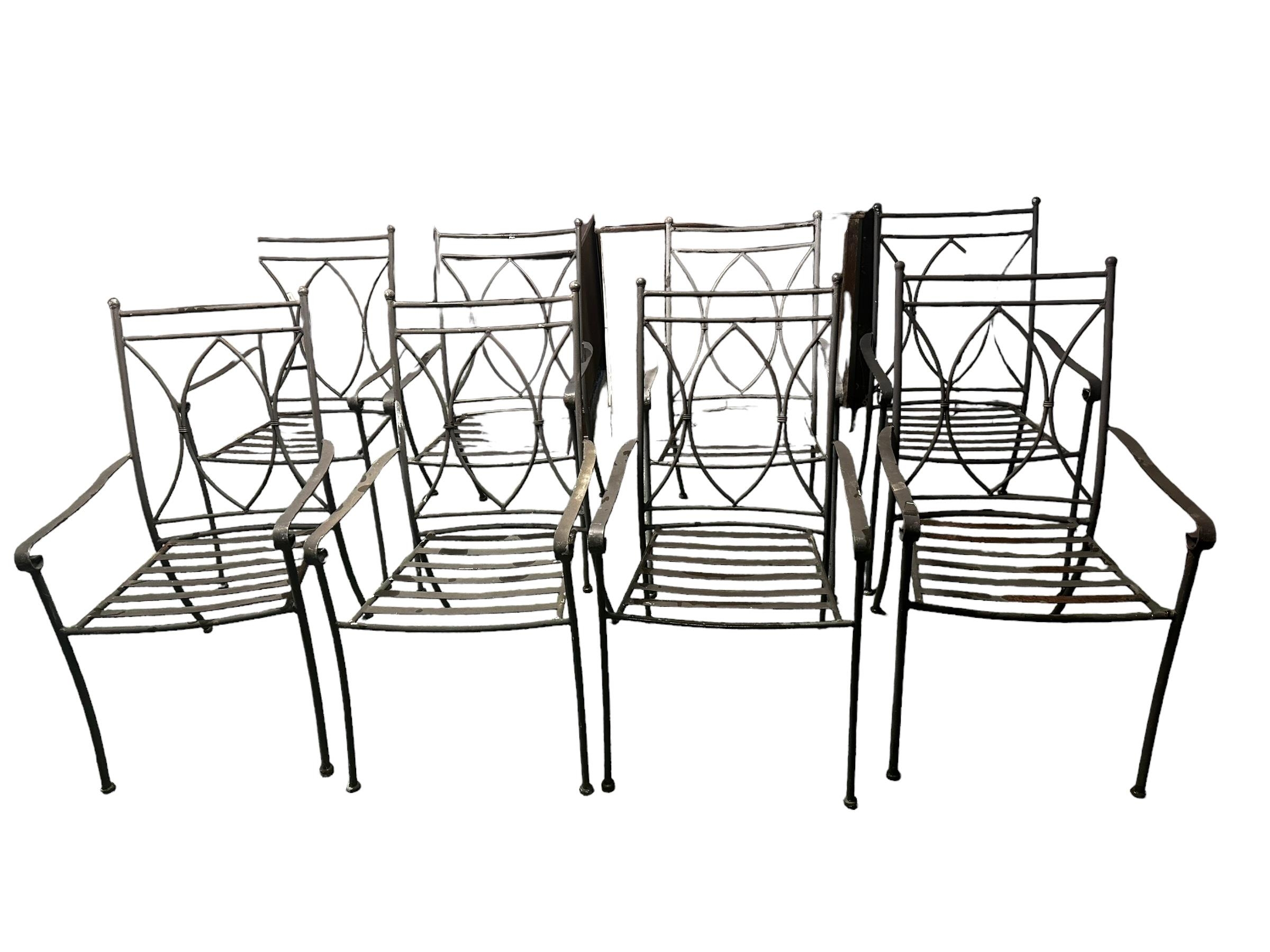 8 Neptune style iron garden arm chairs, (one with some rust). All with some general wear.