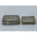 An unmarked white metal pocket snuff box, together with sterling silver matchbox case
