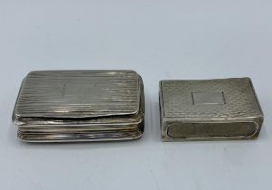 An unmarked white metal pocket snuff box, together with sterling silver matchbox case