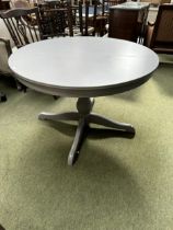 A modern circular grey kitchen table with pedestal base, 110cm diameter