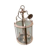 A good brass handing hall lantern, with cylindrical glass, 76cm H overall