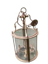 A good brass handing hall lantern, with cylindrical glass, 76cm H overall