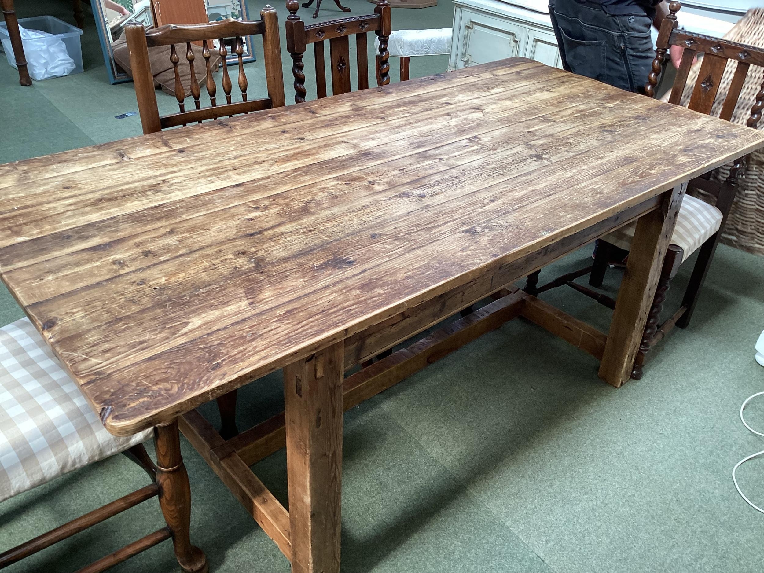 A rustic pine plank top kitchen table, with removable base (needs screwing together after transport)