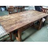 A rustic pine plank top kitchen table, with removable base (needs screwing together after transport)