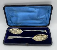 A pair of Georgian Silver spoons in fitted case London 1806, with later Berry decoration 113 g