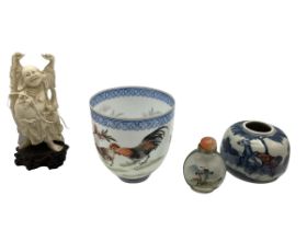 A collection of Oriental items to include a Ching dynasty blue and white pot, a glass inro and other