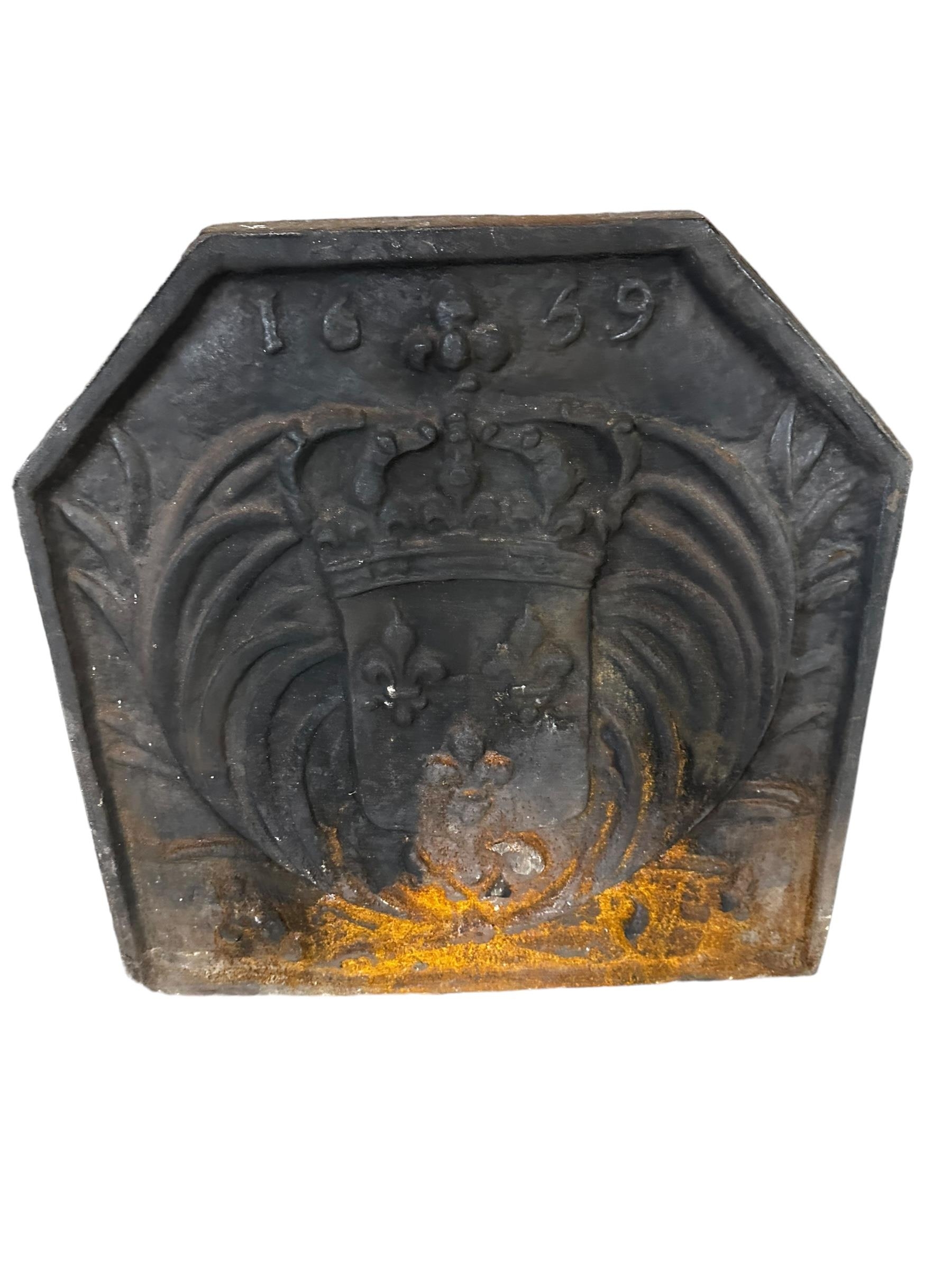 Heavy iron square fireback, with cantered corners, and embossed to back 1659, 60cmH x 57cmW