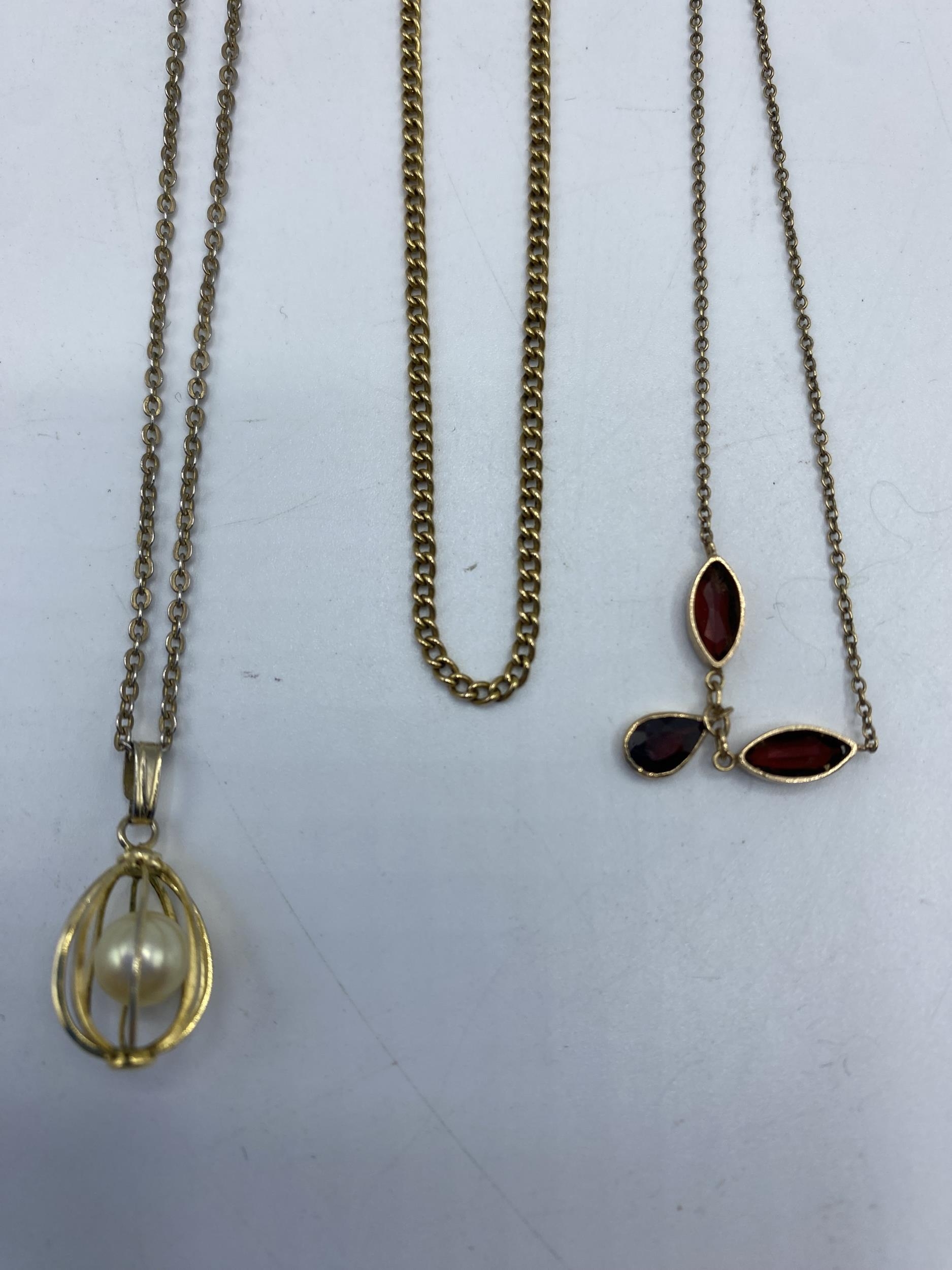 A 15ct gold chain link necklace.(4.5g) together with a 9ct gold necklace with integral garnet set - Image 3 of 3