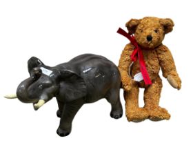 A ceramic Mella-ware model of an elephant29cm High x 37cm ; together with a vintage Deans teddy bear