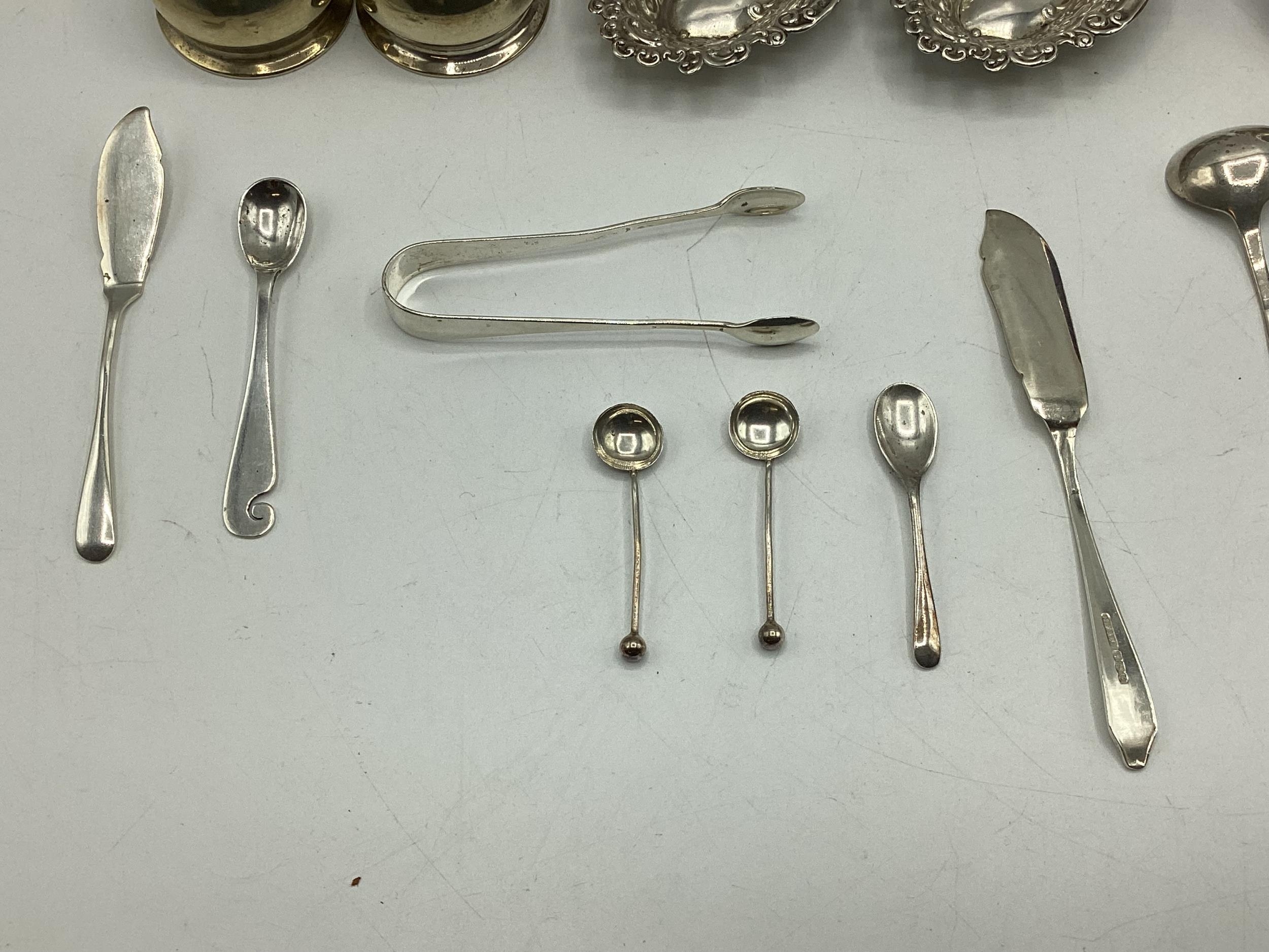 A collection of sterling silver items to include napkin rings , picture frames condiments etc. Gross - Image 4 of 15