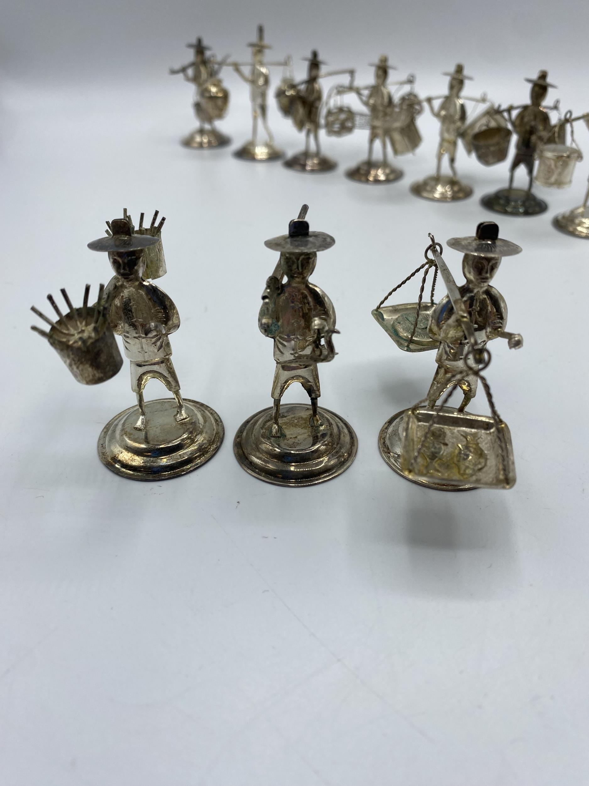 A set of 10 Hong Kong Sterling silver figures of gentlemen carrying baskets. together with a - Image 3 of 10