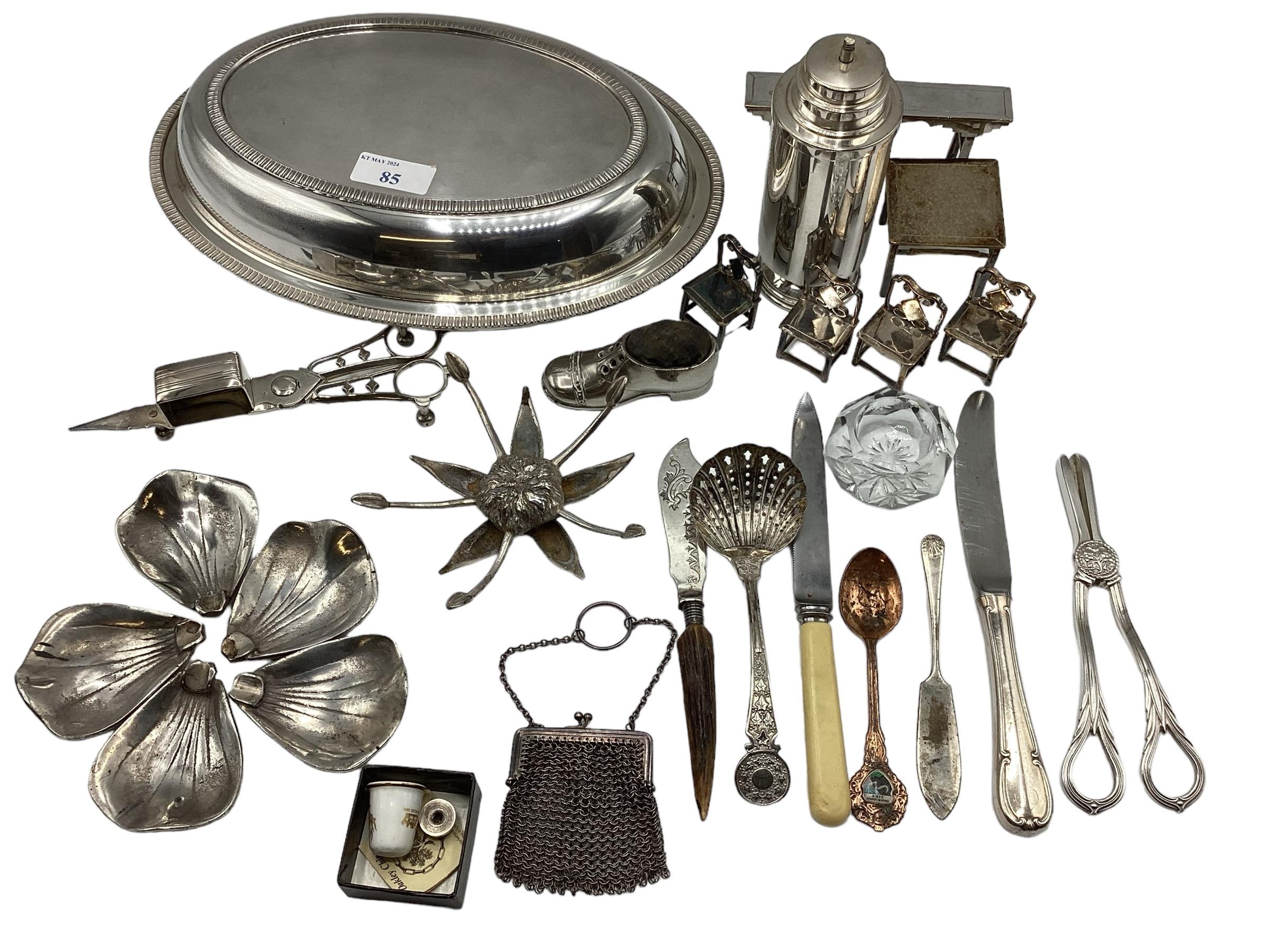 A collection of unmarked white metal items to include wick scissors, dolls house furniture and other