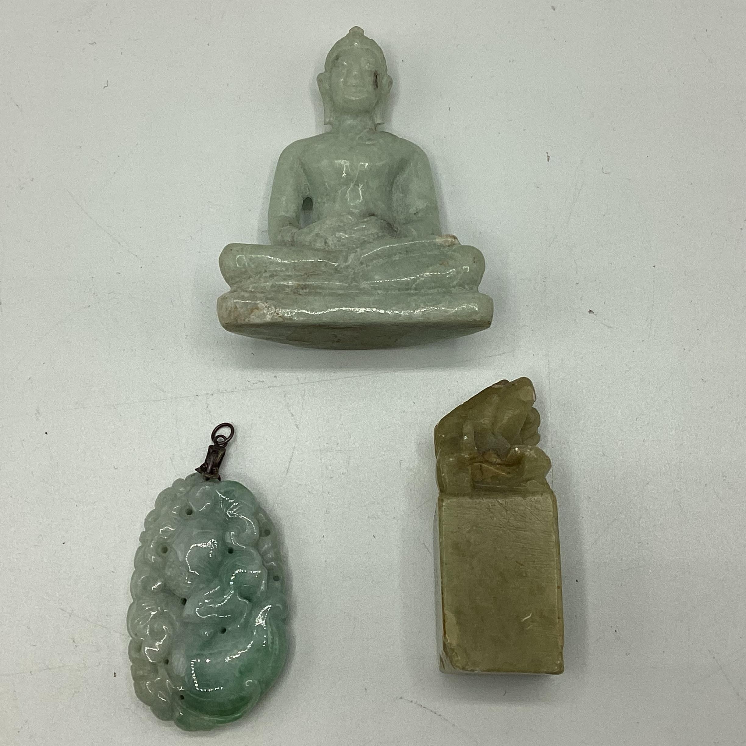 A carved jade pendant together with a small seated buddha and a hardstone seal topped by Fo dog. - Image 2 of 2