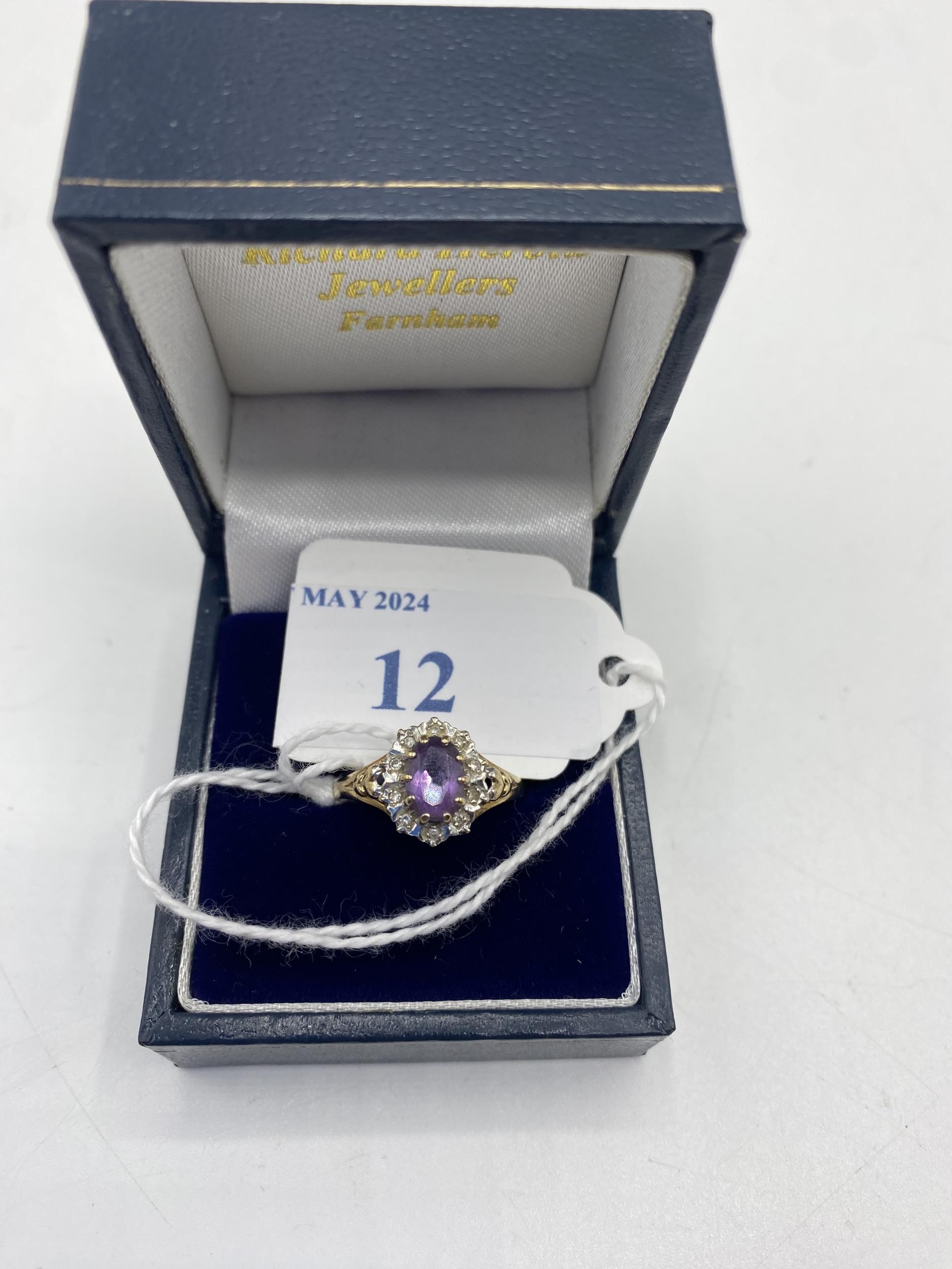 A 9ct gold amethyst and diamond ring. Central oval free cut amethyst with a surround of illusion set - Image 5 of 5