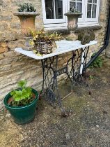 A Singer metal base with white marble top, 91cm W, some wear (table only - not anything else in