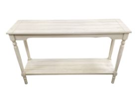 A modern cream two tier side table, 120.5 cm L