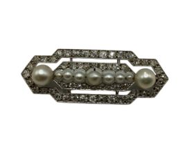 An 18ct white gold and platinum diamond and pearl set brooch. In the art deco style. Line of 6