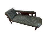 A Victorian green patterned upholstered Chaise longue raised on turned legs to castors , 181cm L