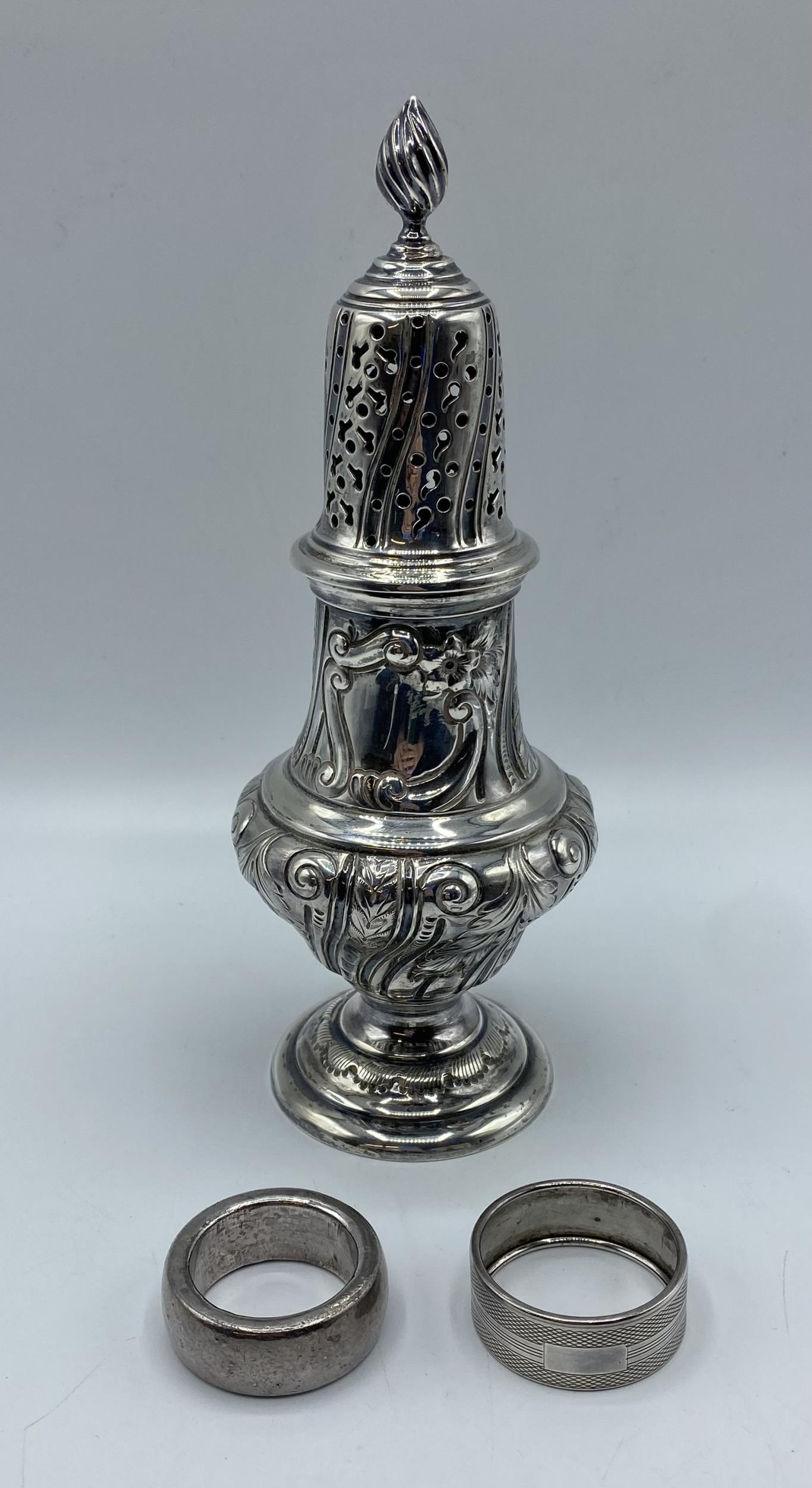 A sterling silver sugar sifter by Walker and Hall Sheffield 1901, together with sterling silver