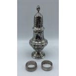 A sterling silver sugar sifter by Walker and Hall Sheffield 1901, together with sterling silver