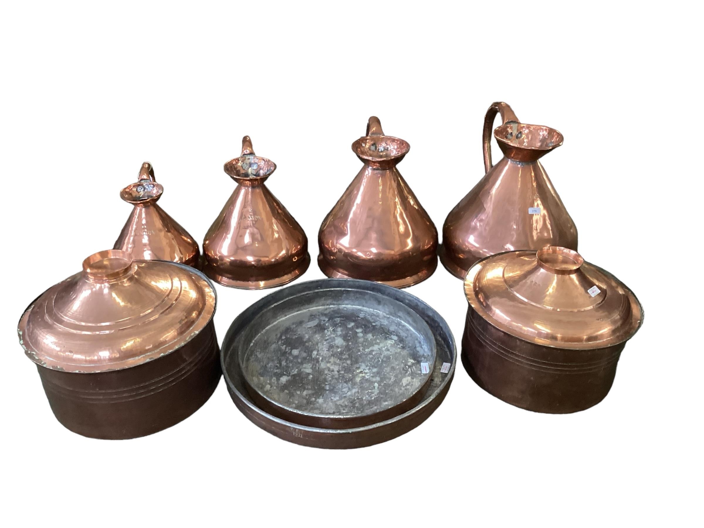 A very good copper items to include 4 graduated sized copper jugs, the largest 42cm high and stamped