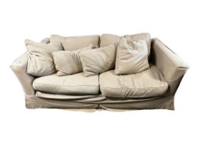 Large good quality sofa khaki coloured loose covers. Condition commensurate with use. 202 cm W