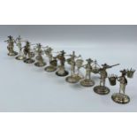 A set of 10 Hong Kong Sterling silver figures of gentlemen carrying baskets. together with a