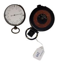 A miniature barometer and compass