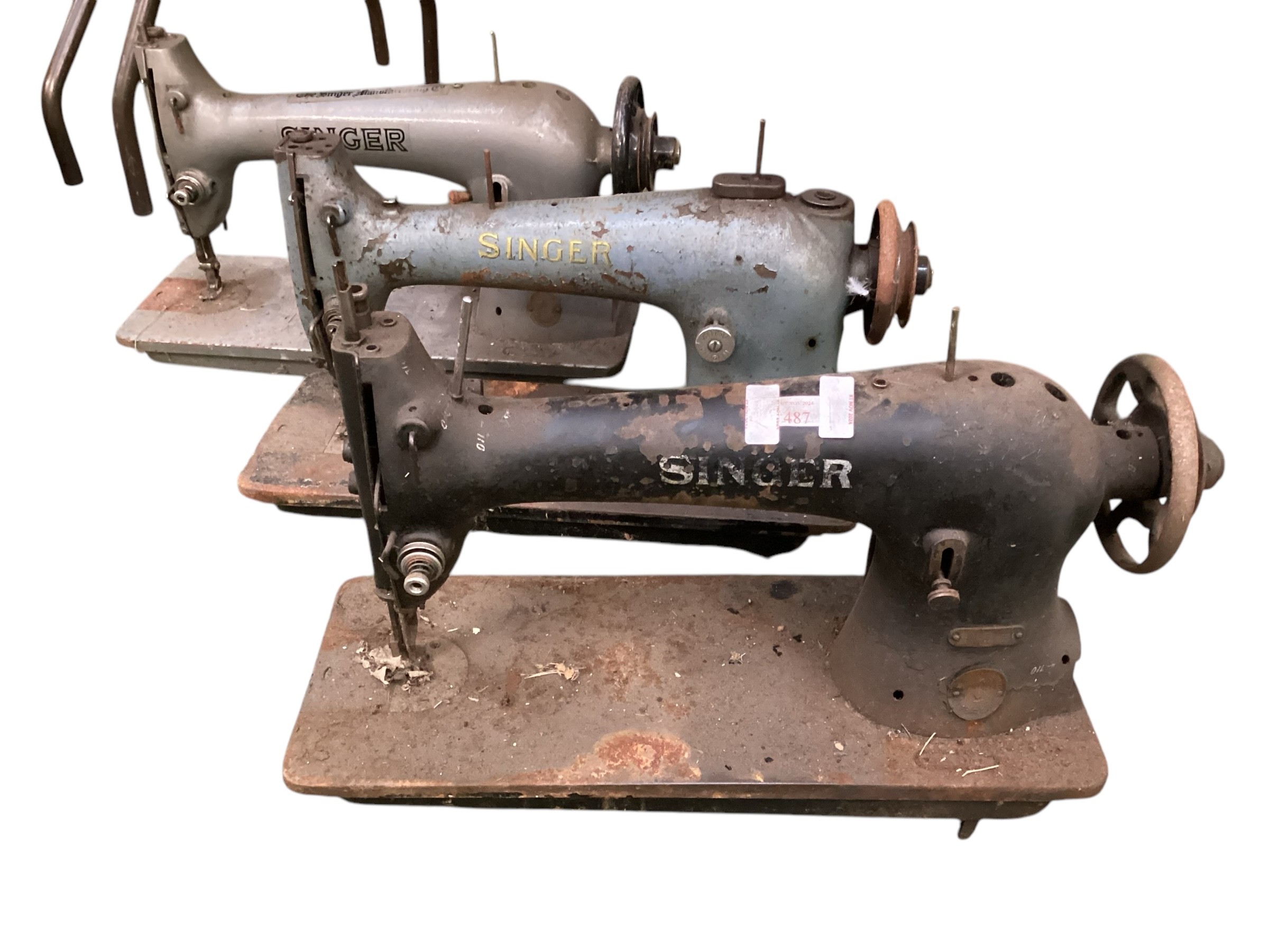 Three vintage Singer sewing machines