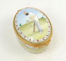 ‘W.G. Grace’. Halcyon Days oval enamelled pill box. The lid decorated with full length figure of