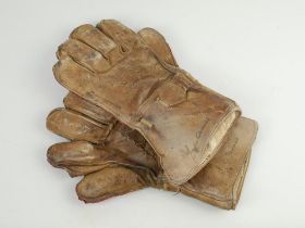 Wicket keeping gauntlets 1920’s. An example of a pair of leather wicket-keeping gloves used in the