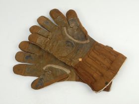 Wicket keeping gauntlets 1910’s. An early example of a of a pair of brown leather wicket-keeping