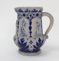 Westerwald stoneware cricket water jug, moulded in relief with five cameo panels of a batsman,