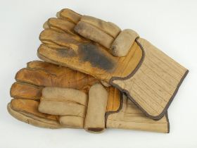 Wicket keeping gauntlets 1920’s. An example of a pair of leather wicket-keeping gloves used in the