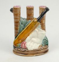 Cricket spill vase. Majolica glazed spill vase formed as three hollow stumps, moulded in relief on