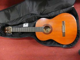 A Yamaha G-55 acoustic guitar, with canvas carrying bag (2)